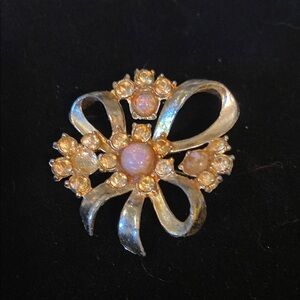 Gold Bow Brooch with pink and crystal stones.